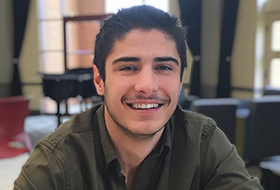 La Roche University student sitting in the Zappala Campus Center Square